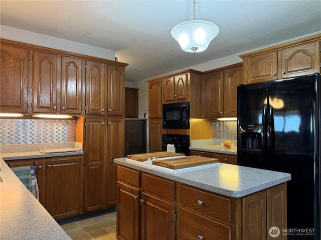 4208 W Okanogan Ave, Kennewick, WA 99336 - kitchen with black appliances, light countertops, and backsplash