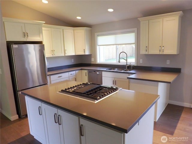 2568 Myra Pl, Langley, WA 98260 - kitchen featuring stainless steel appliances, a center island, wood finished floors, white cabinets, and recessed lighting