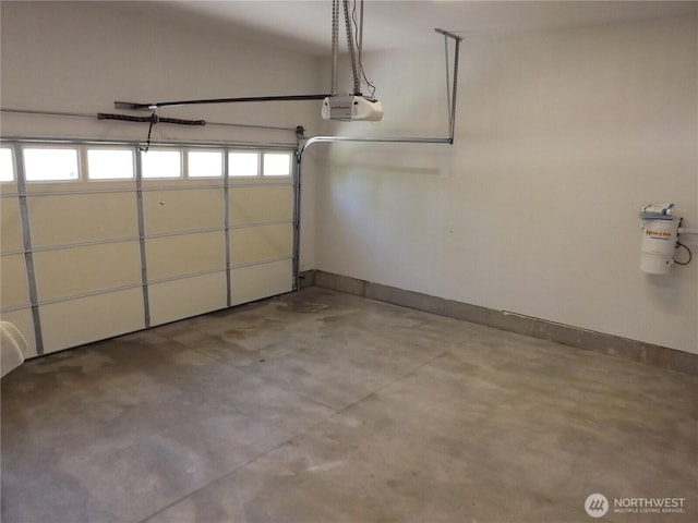2568 Myra Pl, Langley, WA 98260 - garage featuring a garage door opener and baseboards