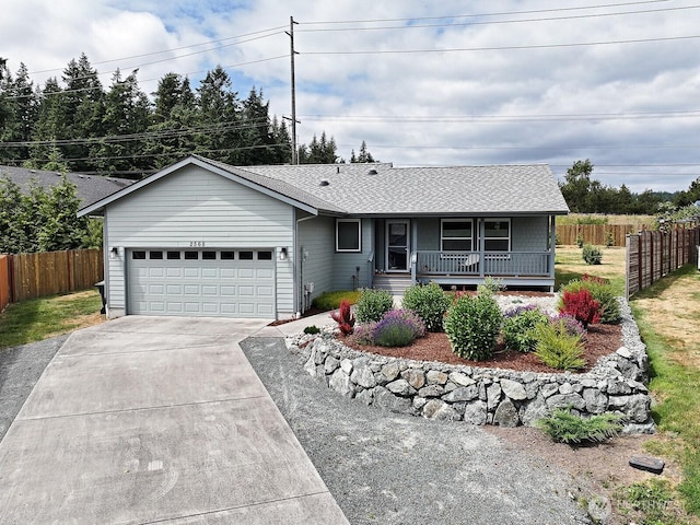 2568 Myra Pl, Langley, WA 98260 - ranch-style home featuring covered porch, concrete driveway, an attached garage, and roof with shingles