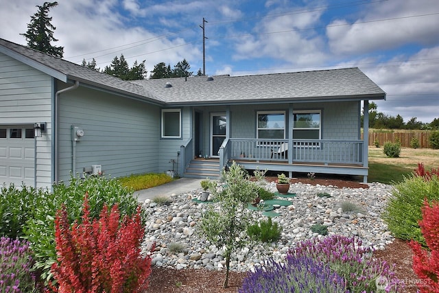 2568 Myra Pl, Langley, WA 98260 - view of front of home featuring a porch, a garage, and a shingled roof