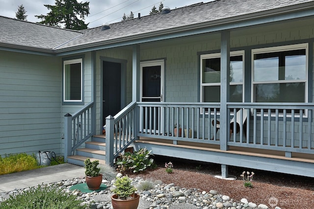 2568 Myra Pl, Langley, WA 98260 - property entrance featuring a shingled roof and covered porch