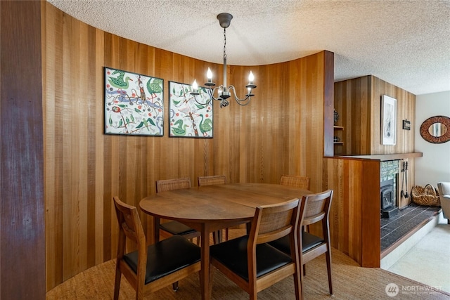 10500 Mt Baker Hwy Unit 905, Deming, WA 98244 - dining area featuring a textured ceiling, a chandelier, carpet, and wooden walls