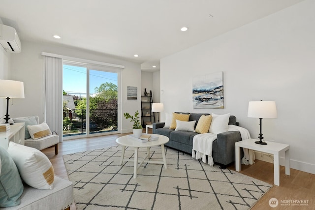 931 N 92nd St Unit B, Seattle, WA 98103 - living room featuring light wood-type flooring, a wall mounted air conditioner, recessed lighting, and baseboards