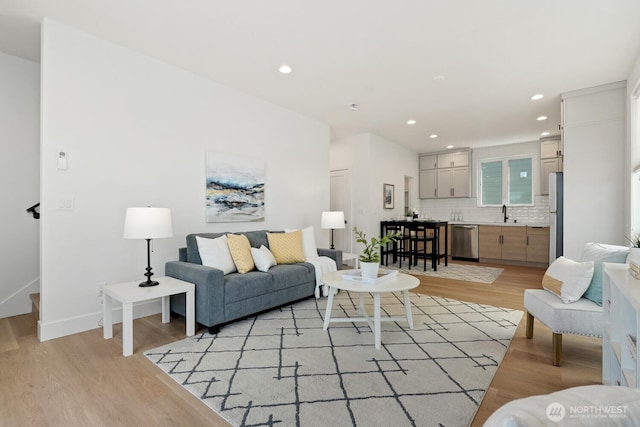 931 N 92nd St Unit B, Seattle, WA 98103 - living room featuring light wood-style flooring, recessed lighting, and baseboards