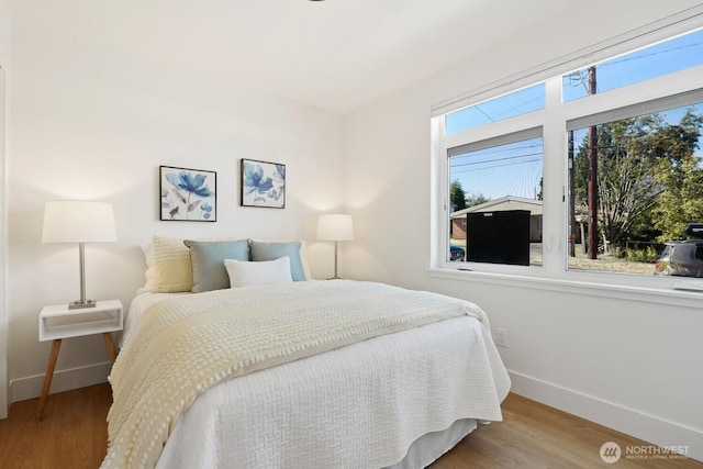 931 N 92nd St Unit B, Seattle, WA 98103 - bedroom with baseboards and wood finished floors
