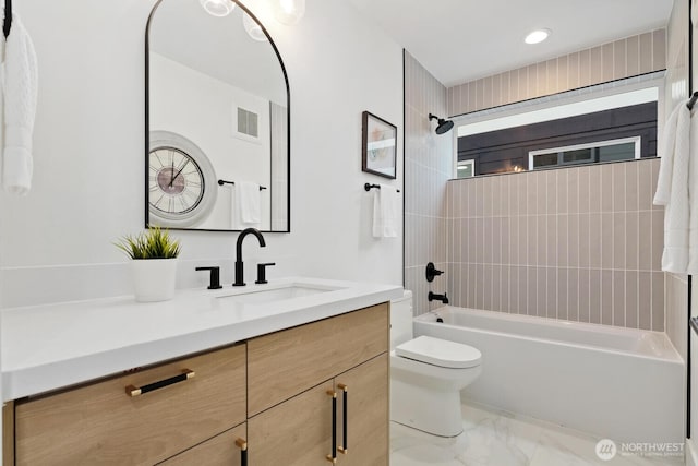 931 N 92nd St Unit B, Seattle, WA 98103 - full bathroom with vanity, toilet, washtub / shower combination, and marble finish floors