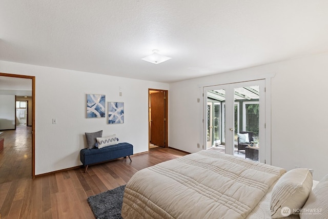 1443 U St, Port Townsend, WA 98368 - bedroom featuring access to outside, french doors, multiple windows, and wood finished floors