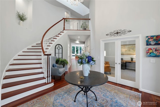 7531 Hawkstone Ave SW, Port Orchard, WA 98367 - foyer with stairway, wood finished floors, french doors, a high ceiling, and a chandelier