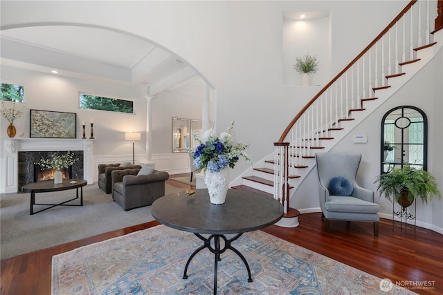 7531 Hawkstone Ave SW, Port Orchard, WA 98367 - entryway with wood finished floors, stairs, a fireplace, arched walkways, and recessed lighting