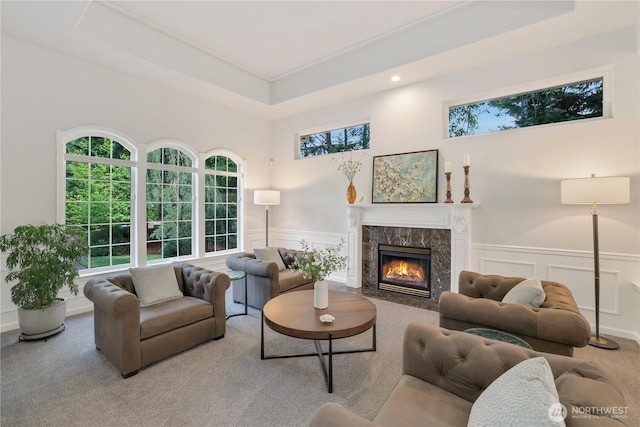 7531 Hawkstone Ave SW, Port Orchard, WA 98367 - living area featuring carpet, a fireplace, a decorative wall, a wainscoted wall, and recessed lighting