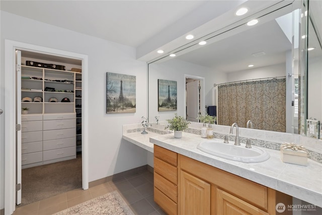 7531 Hawkstone Ave SW, Port Orchard, WA 98367 - full bath featuring vanity, tile patterned floors, a spacious closet, recessed lighting, and baseboards