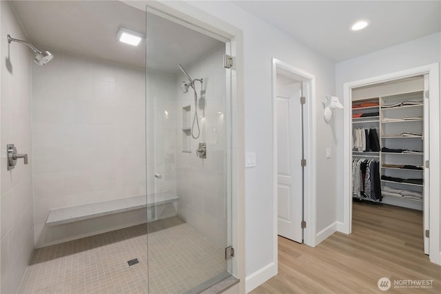 7531 Hawkstone Ave SW, Port Orchard, WA 98367 - full bathroom featuring a shower stall, wood finished floors, a spacious closet, recessed lighting, and baseboards