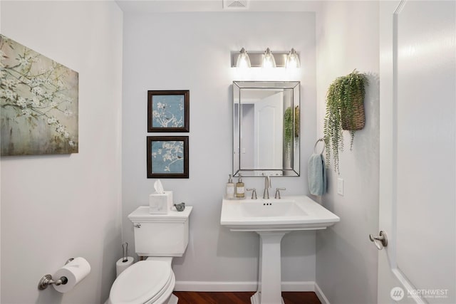 7531 Hawkstone Ave SW, Port Orchard, WA 98367 - half bathroom with toilet, wood finished floors, and baseboards