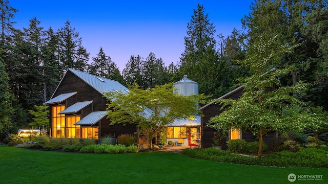 9000 NE Hidden Cove Rd, Bainbridge Island, WA 98110 - view of front of home featuring a lawn, a metal roof, and a standing seam roof