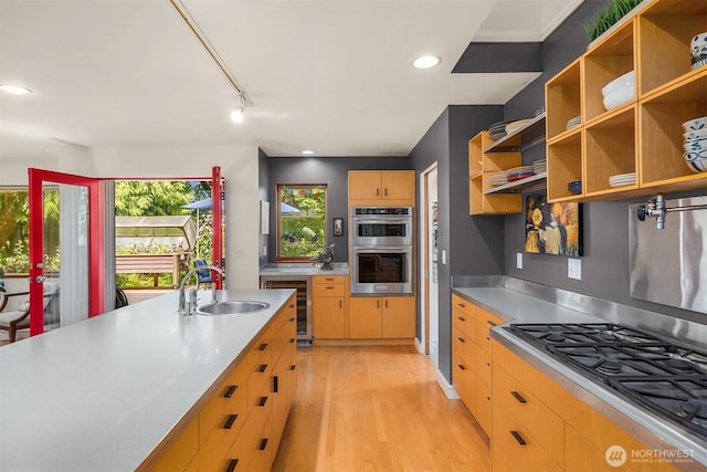 9000 NE Hidden Cove Rd, Bainbridge Island, WA 98110 - kitchen featuring stainless steel counters, wine cooler, stainless steel appliances, open shelves, and light wood-style flooring