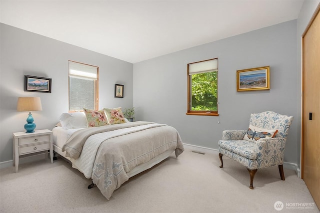 9000 NE Hidden Cove Rd, Bainbridge Island, WA 98110 - bedroom with baseboards and light colored carpet