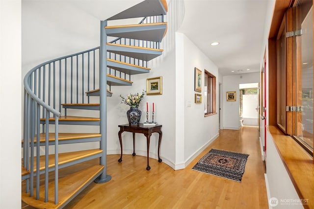 9000 NE Hidden Cove Rd, Bainbridge Island, WA 98110 - stairway featuring wood finished floors and recessed lighting