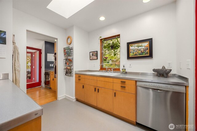 9000 NE Hidden Cove Rd, Bainbridge Island, WA 98110 - kitchen with dishwasher, a skylight, recessed lighting, and stainless steel countertops