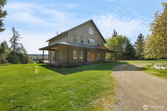 14502 45th St SW, Lakebay, WA 98349 - view of front facade with a porch, a front yard, and dirt driveway
