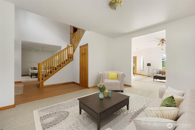 14502 45th St SW, Lakebay, WA 98349 - living area featuring stairway, carpet floors, a ceiling fan, and baseboards