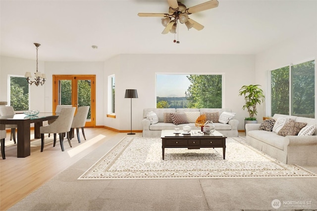 14502 45th St SW, Lakebay, WA 98349 - living area with a chandelier, light wood finished floors, healthy amount of natural light, and ceiling fan