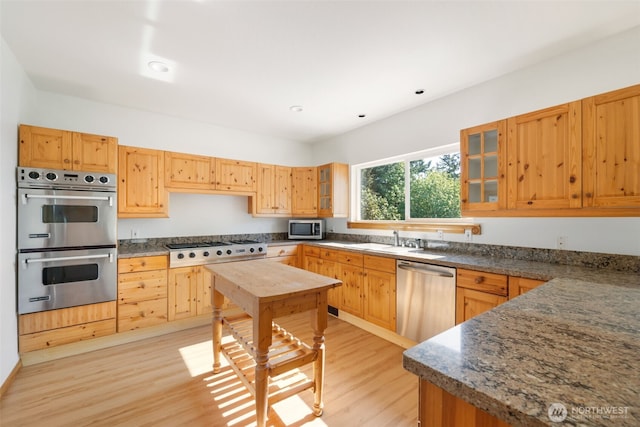14502 45th St SW, Lakebay, WA 98349 - kitchen featuring appliances with stainless steel finishes, light wood-style flooring, glass insert cabinets, a sink, and recessed lighting