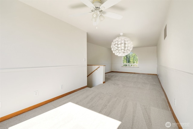 14502 45th St SW, Lakebay, WA 98349 - spare room featuring light carpet, a ceiling fan, baseboards, and vaulted ceiling