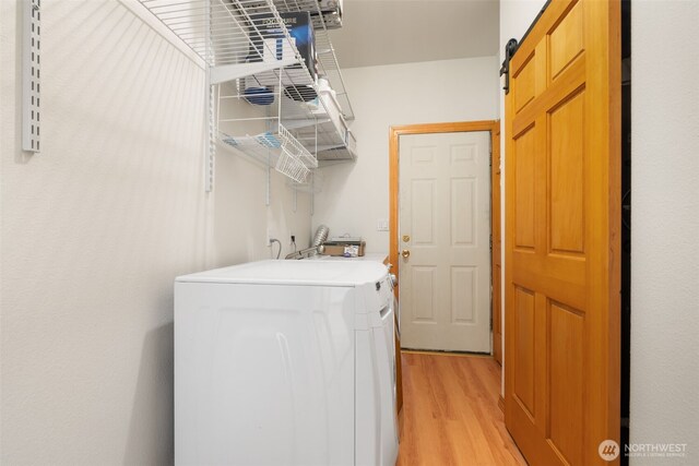 14502 45th St SW, Lakebay, WA 98349 - laundry area featuring washer / dryer and light wood-style floors