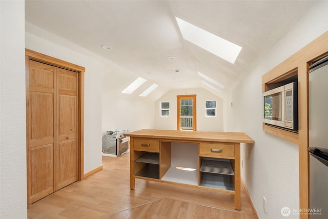 14502 45th St SW, Lakebay, WA 98349 - additional living space featuring a skylight, light wood-style floors, lofted ceiling, and baseboards