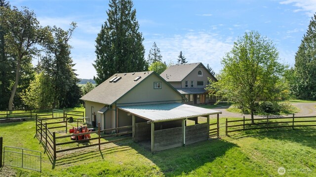 14502 45th St SW, Lakebay, WA 98349 - rear view of house with an exterior structure and an outbuilding