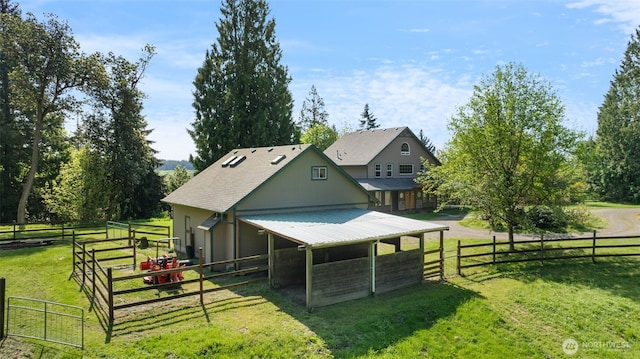 14502 45th St SW, Lakebay, WA 98349 - rear view of house with an exterior structure and an outbuilding