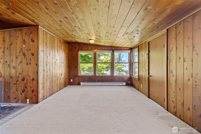 967 High Rd, Camano Island, WA 98282 - carpeted empty room with baseboard heating, vaulted ceiling, wood ceiling, and wood walls