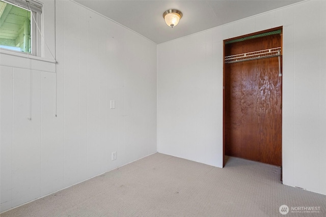 967 High Rd, Camano Island, WA 98282 - unfurnished bedroom with carpet, a closet, and wood walls