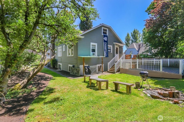 5745 25th Ave NE, Seattle, WA 98105 - rear view of house featuring a lawn and a deck