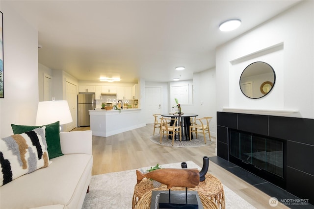 7711 NE 175th St Unit C106, Kenmore, WA 98028 - living area featuring light wood-style floors