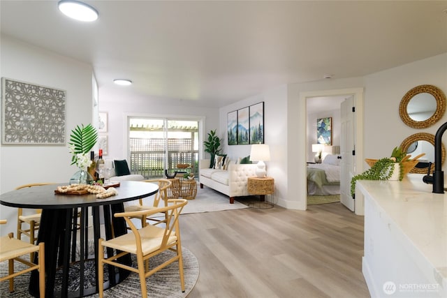 7711 NE 175th St Unit C106, Kenmore, WA 98028 - dining space with light wood finished floors