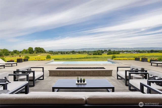 335 Brickwood Dr, Walla Walla, WA 99362 - view of patio / terrace featuring an outdoor living space with a fire pit and a mountain view