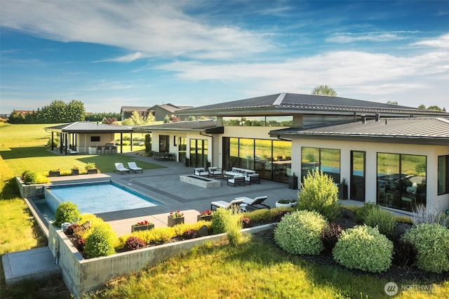 335 Brickwood Dr, Walla Walla, WA 99362 - back of property with a lawn, outdoor lounge area, a patio, and an outdoor pool