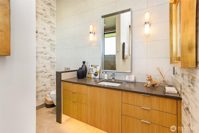 335 Brickwood Dr, Walla Walla, WA 99362 - bathroom featuring vanity, tile walls, tile patterned floors, and tasteful backsplash