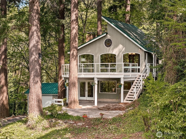 15602 26th Ave SW, Burien, WA 98166 - rear view of property with french doors, stairway, metal roof, and a wooden deck