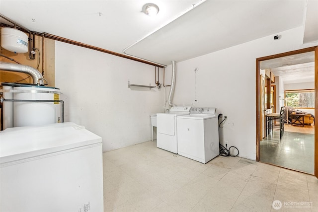 15602 26th Ave SW, Burien, WA 98166 - laundry room featuring washing machine and dryer and light flooring