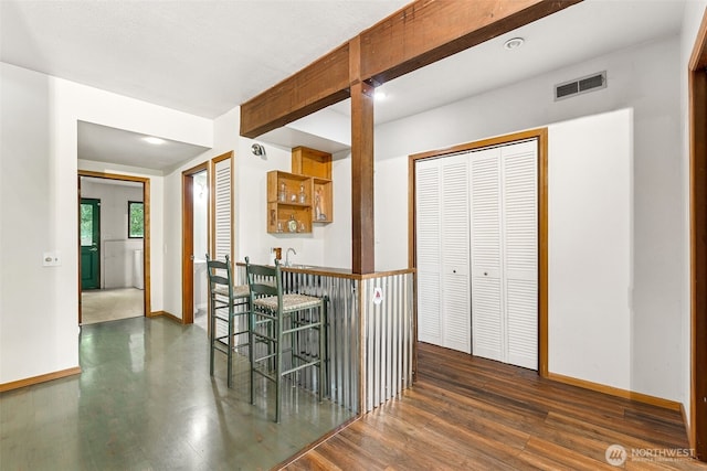 15602 26th Ave SW, Burien, WA 98166 - hallway featuring dark wood finished floors, baseboards, and a sink
