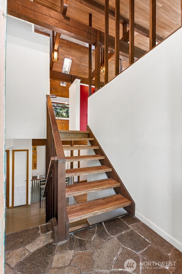 15602 26th Ave SW, Burien, WA 98166 - stairs with beamed ceiling and baseboards