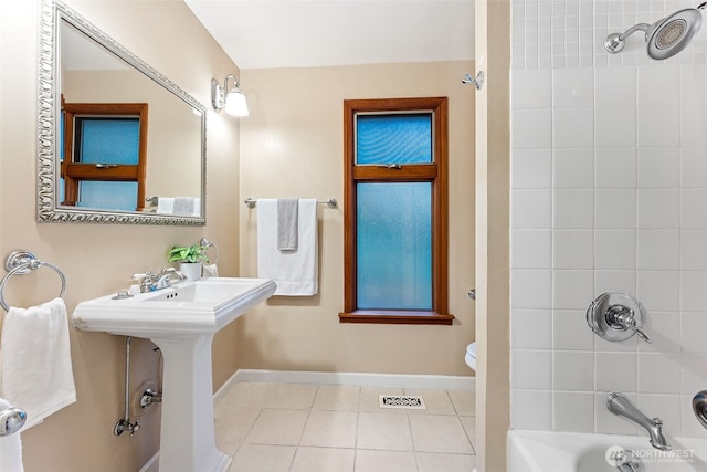 15602 26th Ave SW, Burien, WA 98166 - full bath with tile patterned floors, toilet, shower / tub combination, baseboards, and a sink