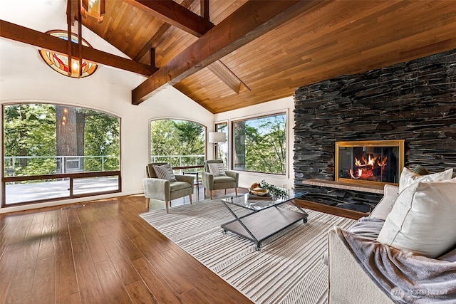 15602 26th Ave SW, Burien, WA 98166 - living area featuring hardwood / wood-style floors, a stone fireplace, high vaulted ceiling, and wood ceiling with exposed beams