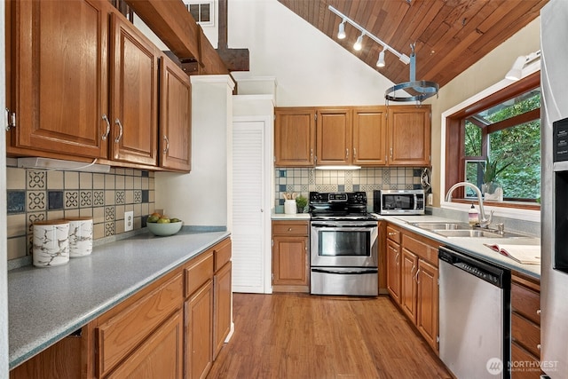15602 26th Ave SW, Burien, WA 98166 - kitchen with stainless steel appliances, a sink, wooden ceiling, lofted ceiling, and decorative backsplash