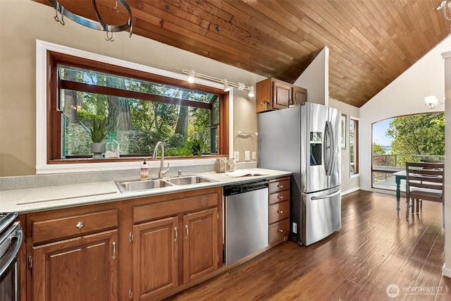15602 26th Ave SW, Burien, WA 98166 - kitchen with appliances with stainless steel finishes, a sink, light countertops, brown cabinetry, and lofted ceiling