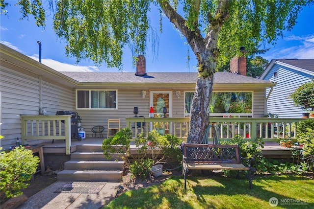 12421 2nd Ave S, Seattle, WA 98168 - view of front of house featuring a chimney and a deck