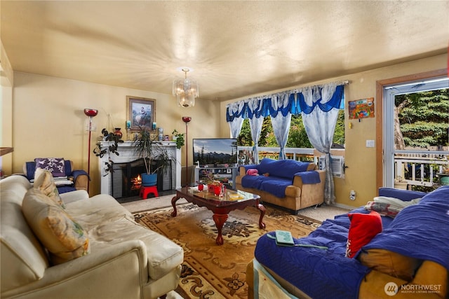 12421 2nd Ave S, Seattle, WA 98168 - living room with healthy amount of natural light, carpet flooring, a chandelier, and a fireplace with flush hearth